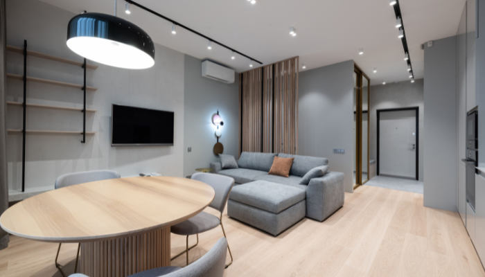 Modern Home Furniture Trivandrum living room with luxury sofa, dining table, and wooden furniture.